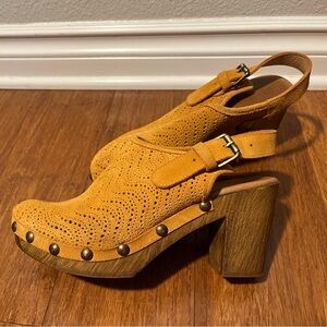 Yellow-orange/amber, small heel, clogs.